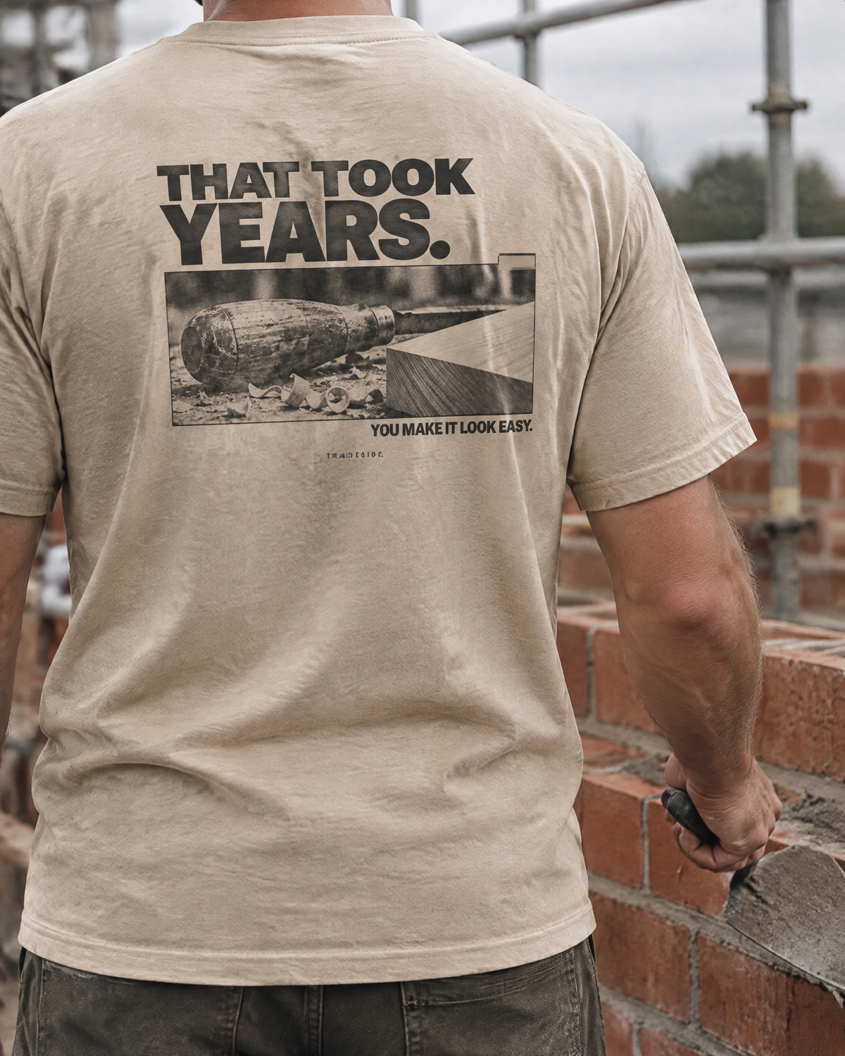 That Took Years tee, back print, worn by a bricklayer