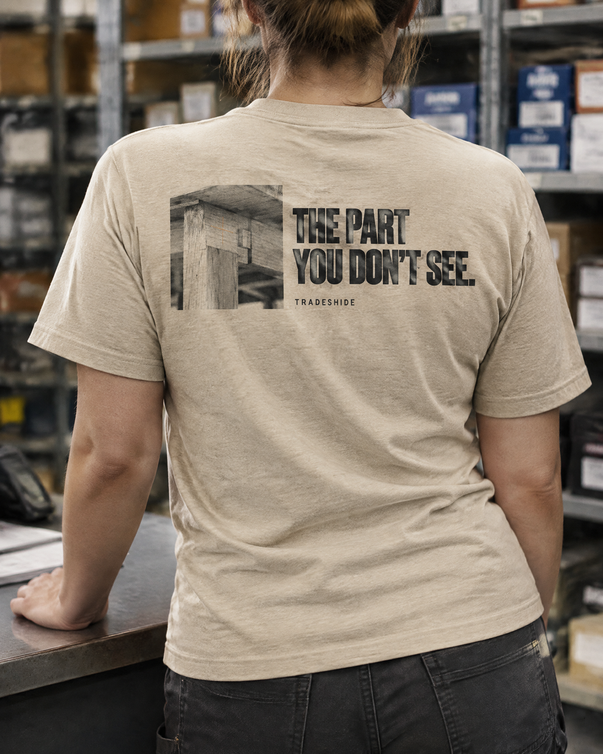 The Part You Don't See tee, back print, worn at a trade parts counter