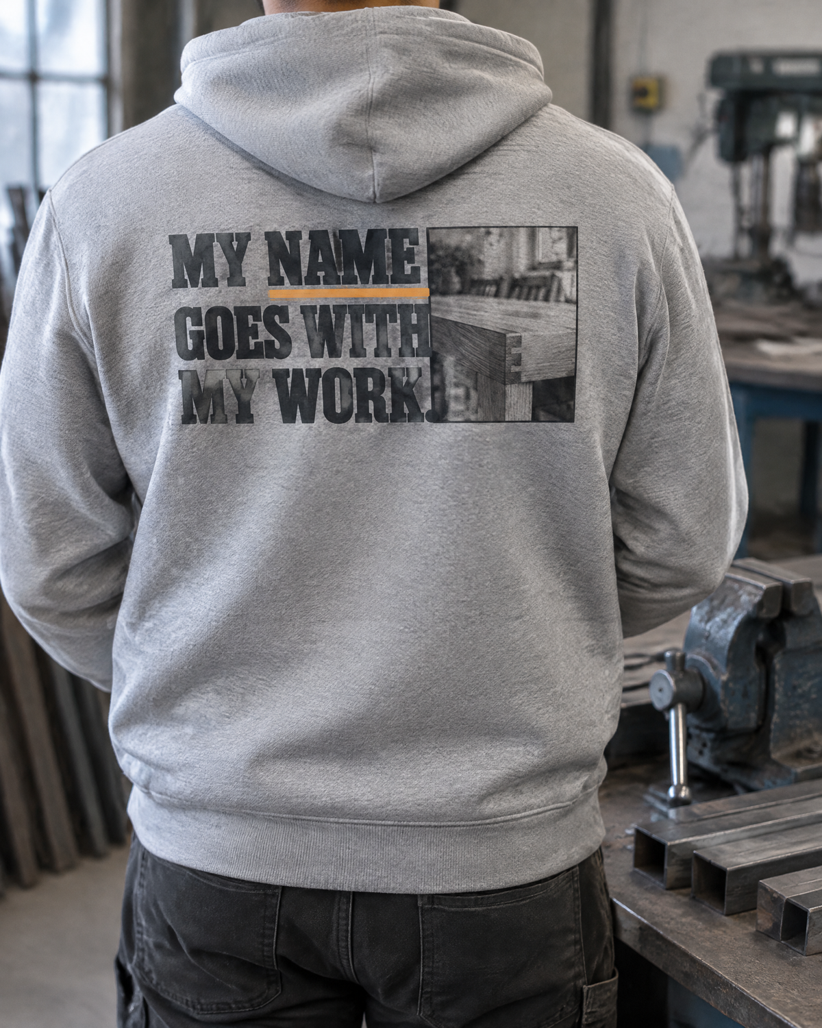 My Name Goes With My Work hoodie, back print, worn by a fabricator