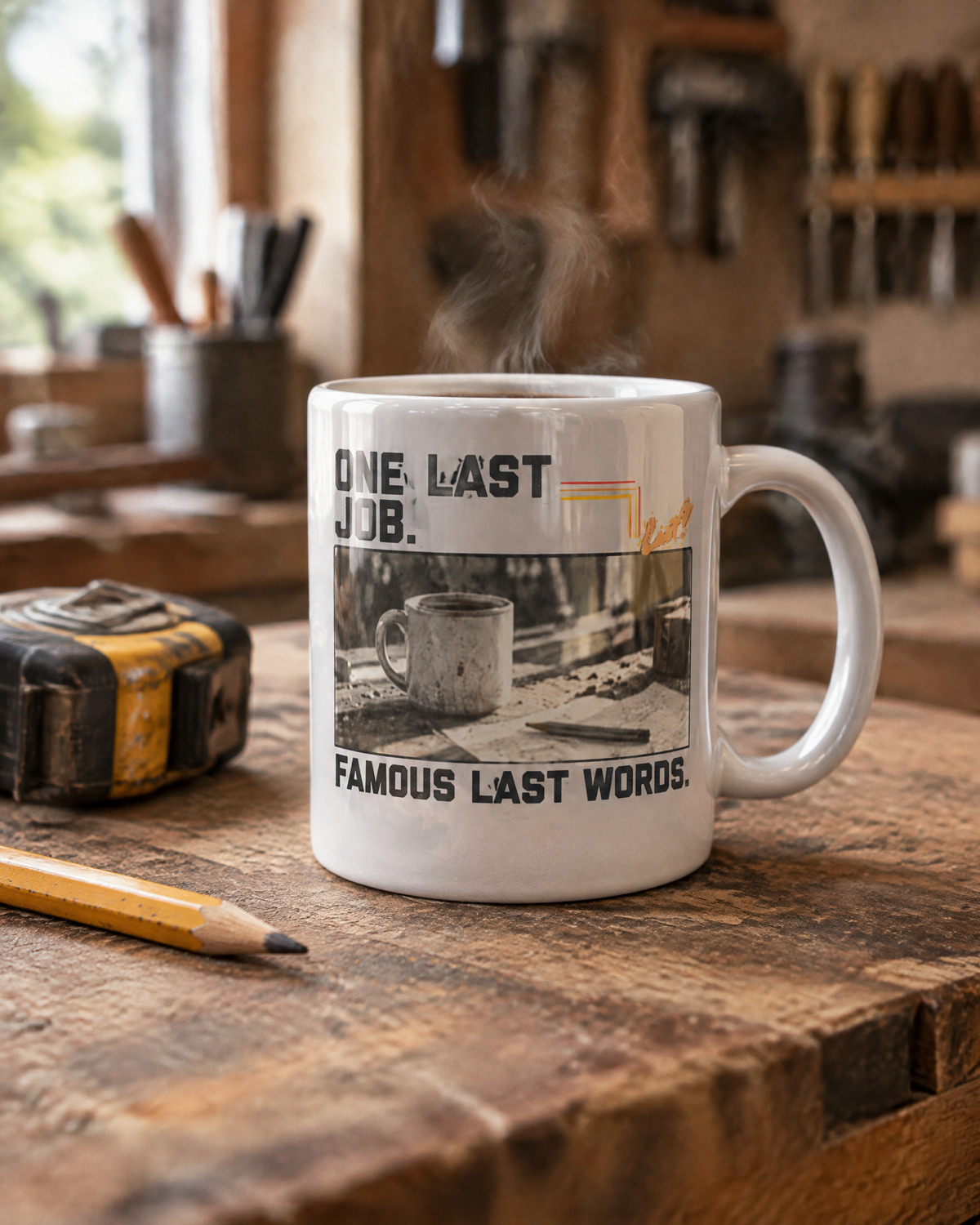One Last Job mug on a workbench with a tape measure