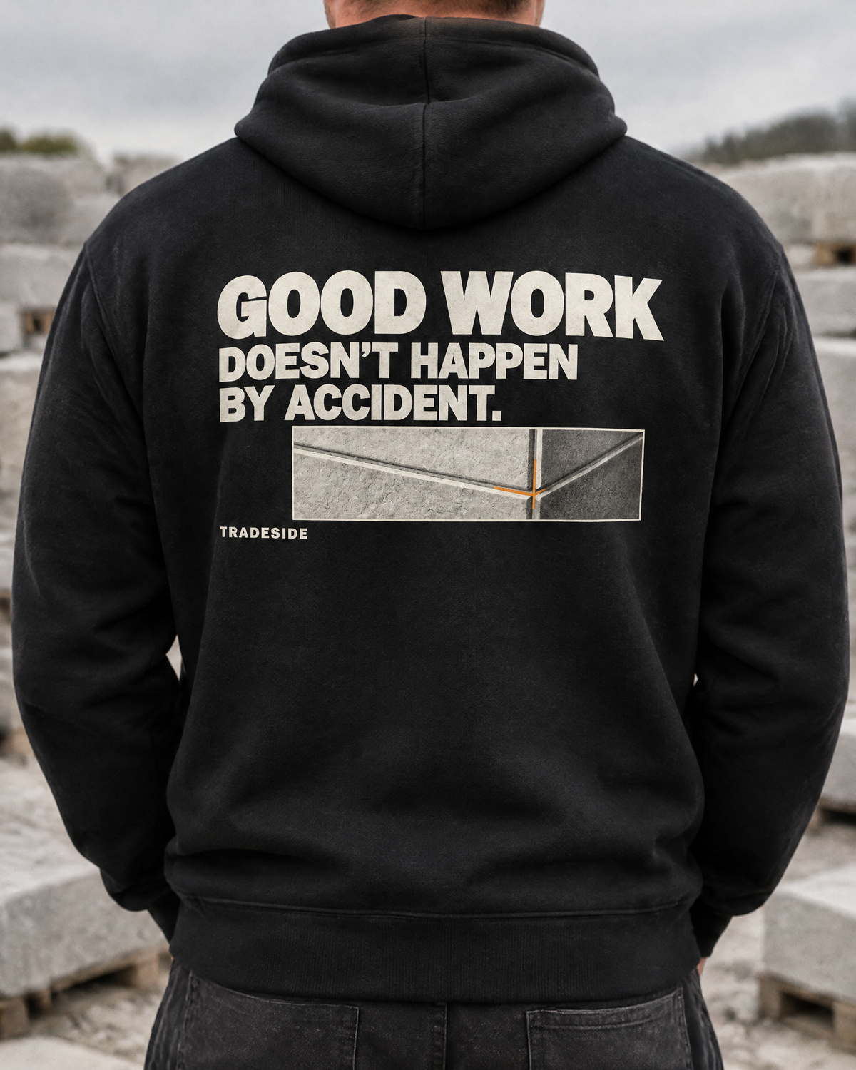 Good Work Doesn't Happen by Accident hoodie, back print, worn by a stonemason